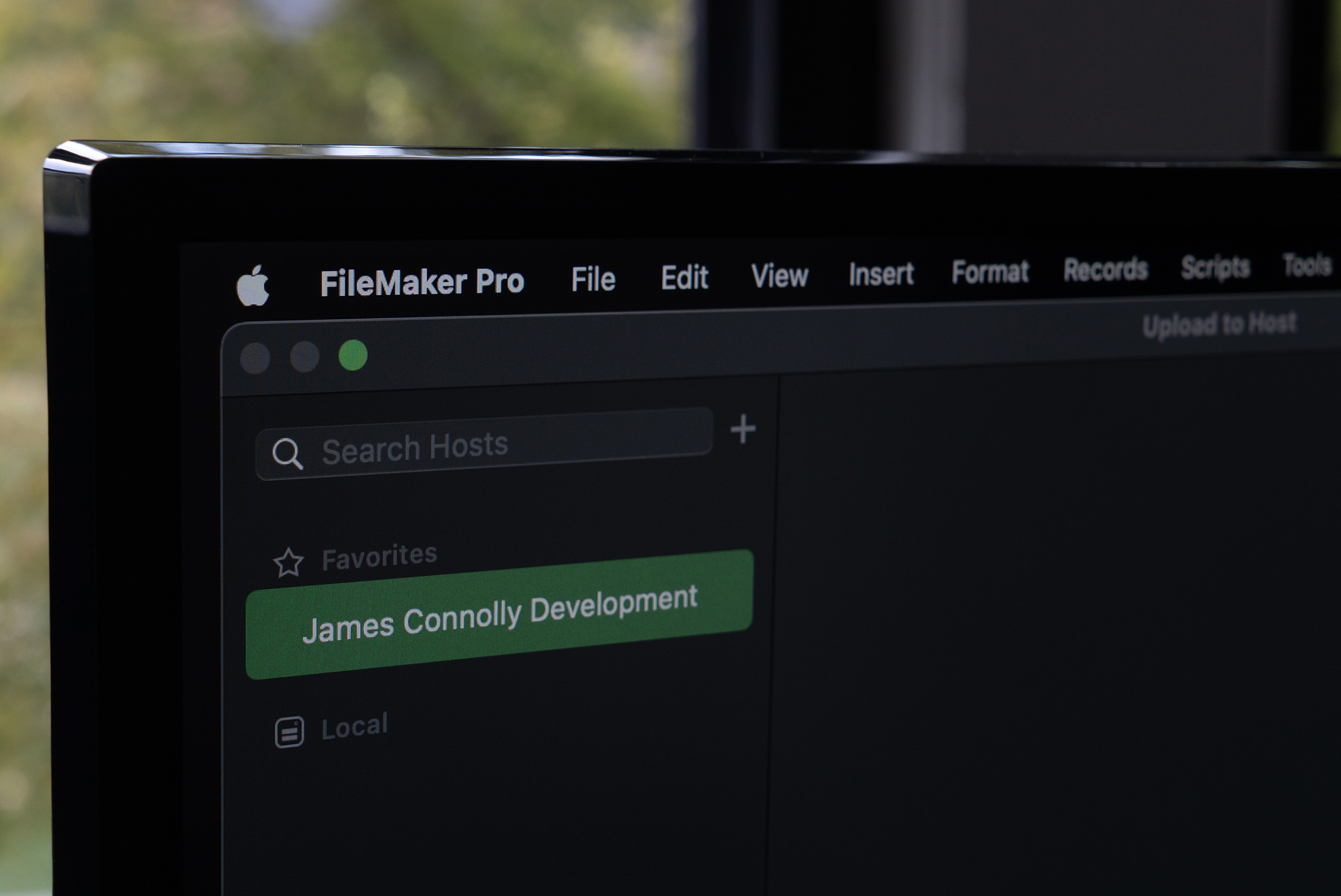 Computer monitor showing a FileMaker app being uploaded.